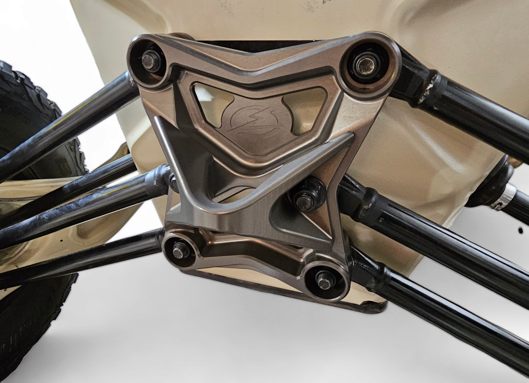 2017-2021 Can Am X3 Maverick EOD Radius Rod Plate with Tow Hook Gun Metal installed on UTV suspension.