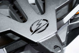 Close-up of the logo on a durable part for 2017-2024 Can Am X3 Maverick Volt Series Baja Spare Tire Rack.