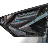 Close-up of front door storage pockets installed on RZR Pro XP