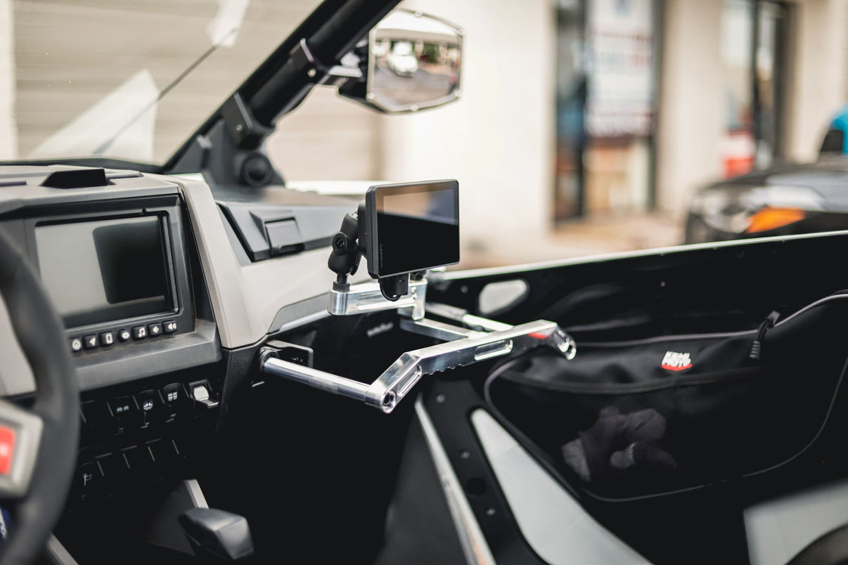 RZR Pro XP/R Metal Head Mount installed in a side-by-side vehicle showcasing a Garmin Tread GPS unit for versatile navigation.