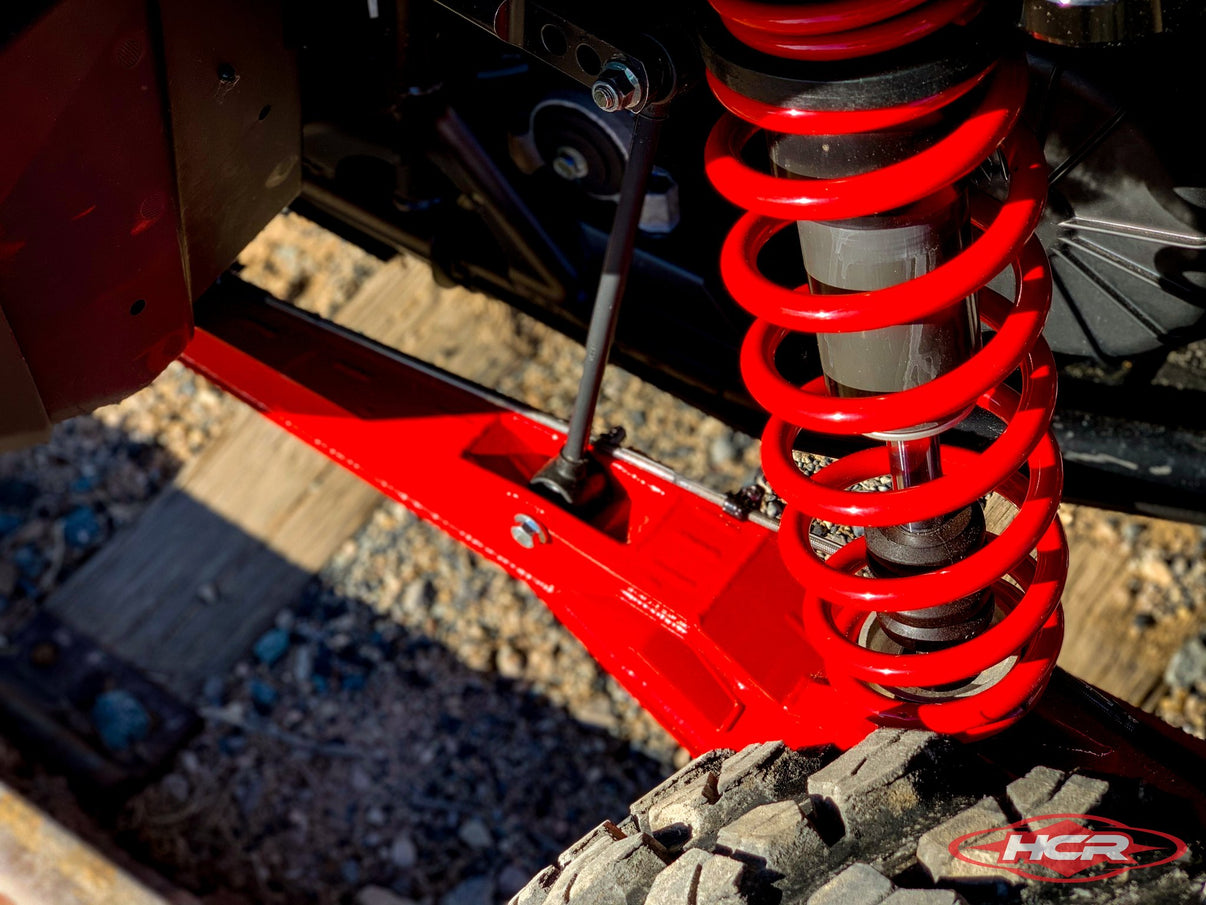POLARIS RZR PRO XP OEM REPLACEMENT TRAILING ARMS showcasing HCR's red suspension components for rugged off-road performance.