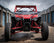 HCR RACING TAL-05400 HONDA TALON 1000R LONG TRAVEL SUSPENSION KIT showcased on a UTV in a storage area.