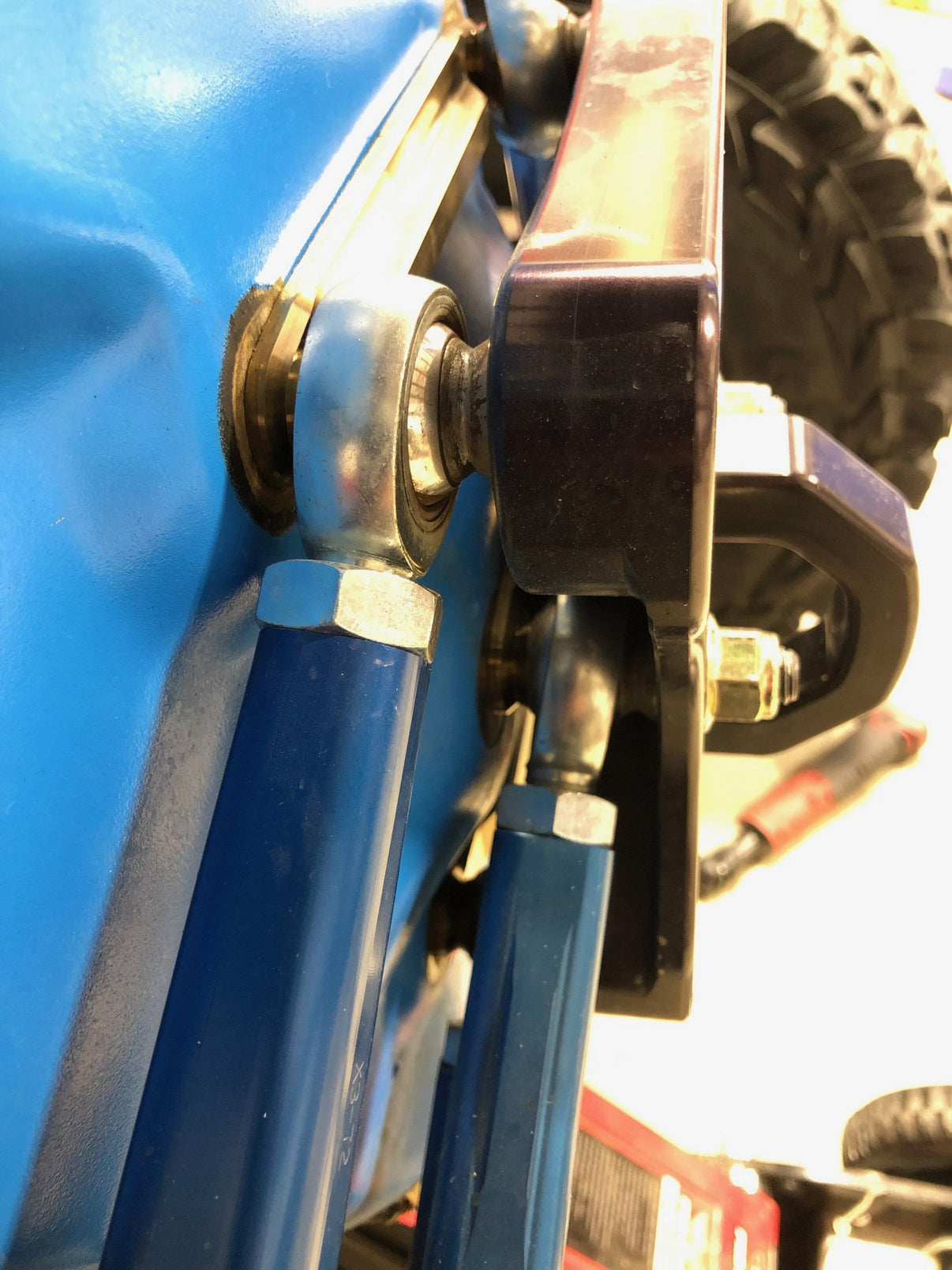 Radius Rod Dog Bones Set Of 3 installed on UTV suspension, showcasing quality and precision for off-road performance.