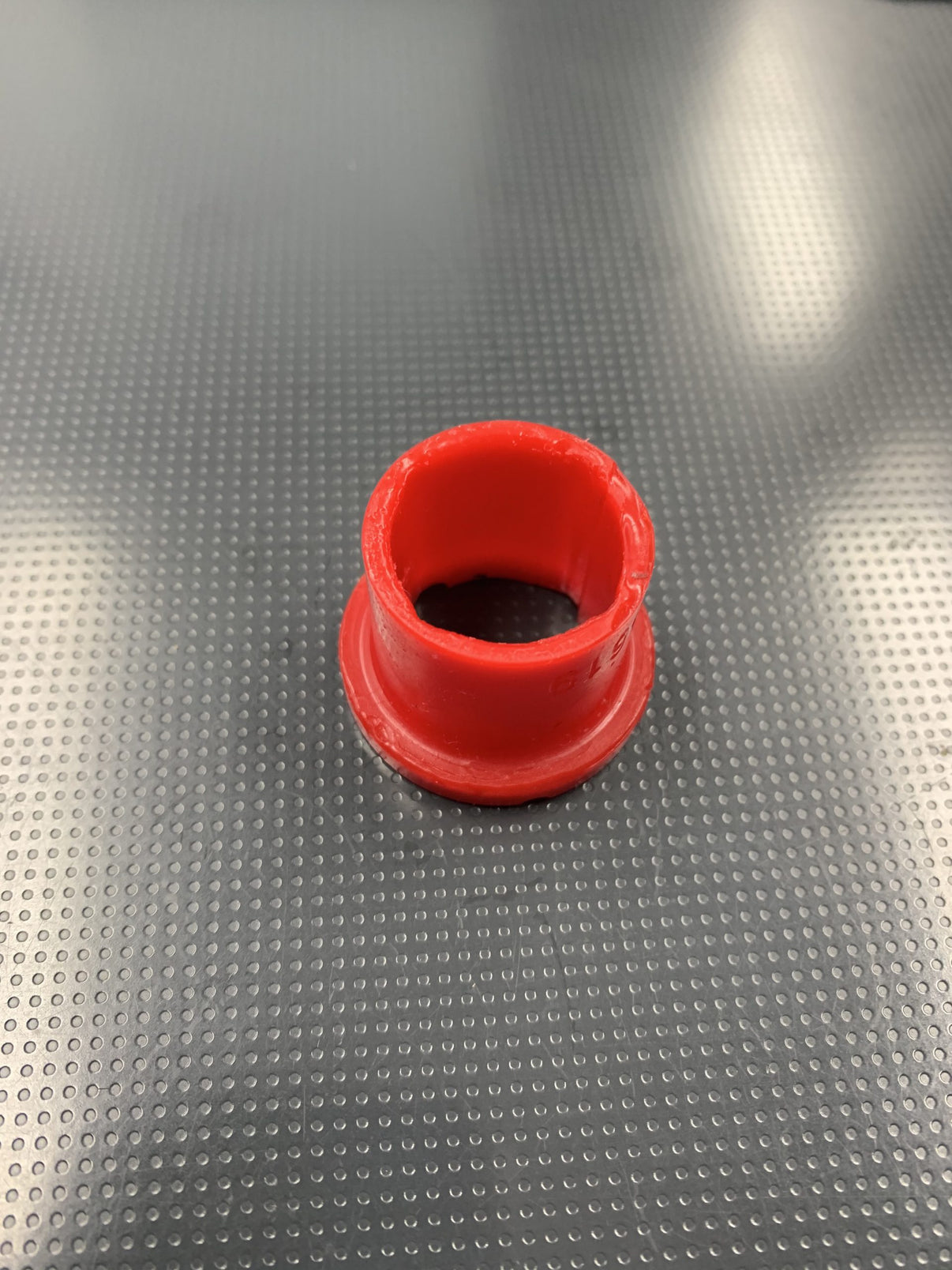 Can Am X3 A Arm bushing kit part in red, designed for suspension tuning and performance upgrades in UTVs.