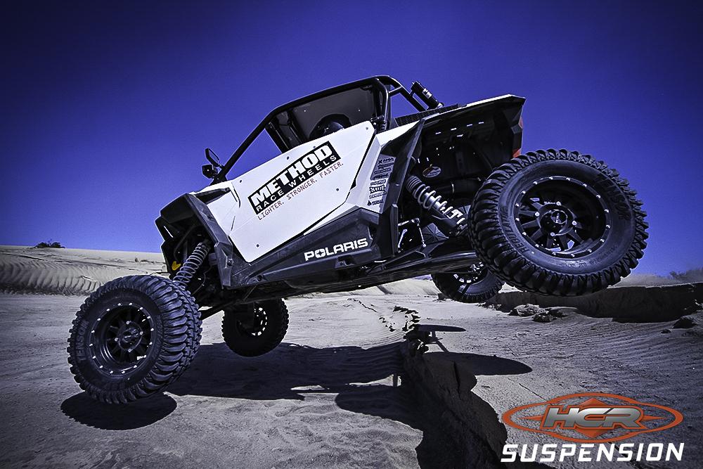 HCR Racing RZR-05300-2 Polaris RZR XP 1000 OEM Replacement Rear Trailing Arms showcasing off-road capabilities.