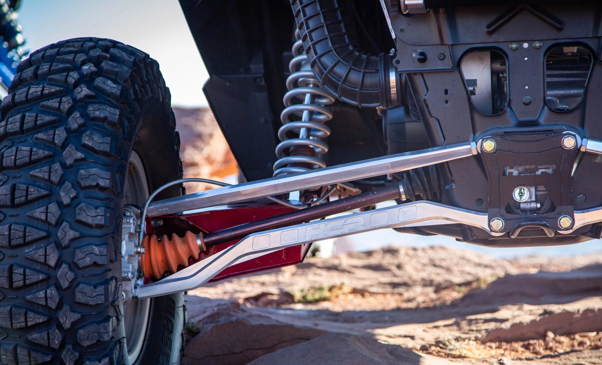 HCR Suspension RZR-05406-10 Aluminum High Link Set for RZR XP 1000 HCR Long-Travel on an off-road vehicle.