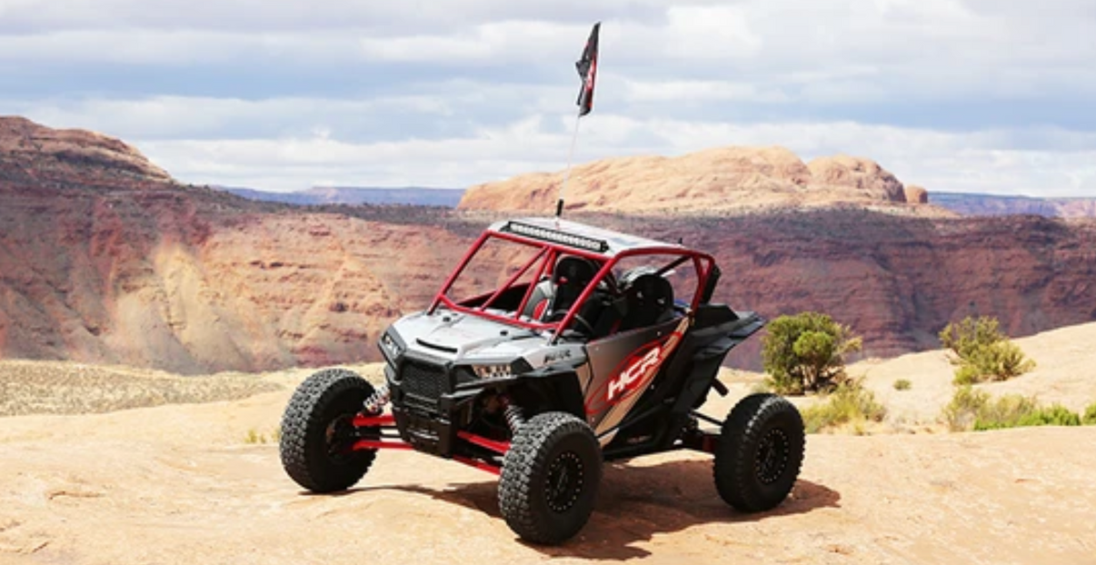 RZR-05400 Polaris RZR XP 1000 Dual Sport LT Suspension Kit on a rugged off-road terrain showcasing strength and performance.