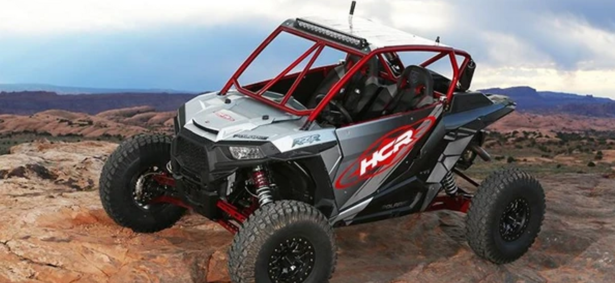RZR-05600 Polaris RZR XP 1000 ELITE Long Travel Suspension Kit showcased on rocky terrain, enhancing off-road performance.
