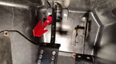WILD CAT 1000 PARKING BRAKE installed view showcasing the red lever and mechanism for secure parking.