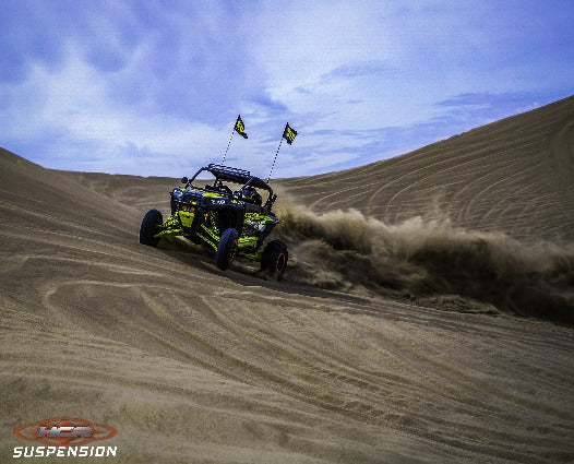 HCR Racing RZR-05200 Polaris RZR XP 1000 Elite OEM Replacement Kit in action on sandy dunes.