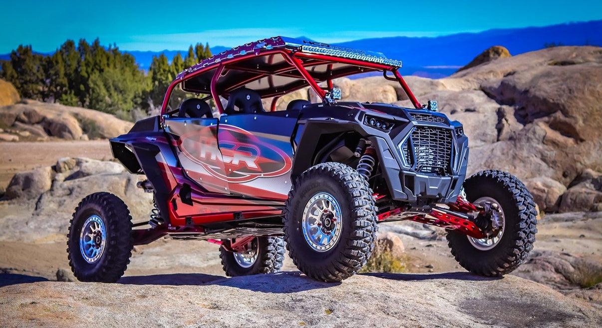 HCR Racing RZR-05800 Polaris RZR XP 1000 Elite Mid-Travel Suspension Kit showcased on rocky terrain